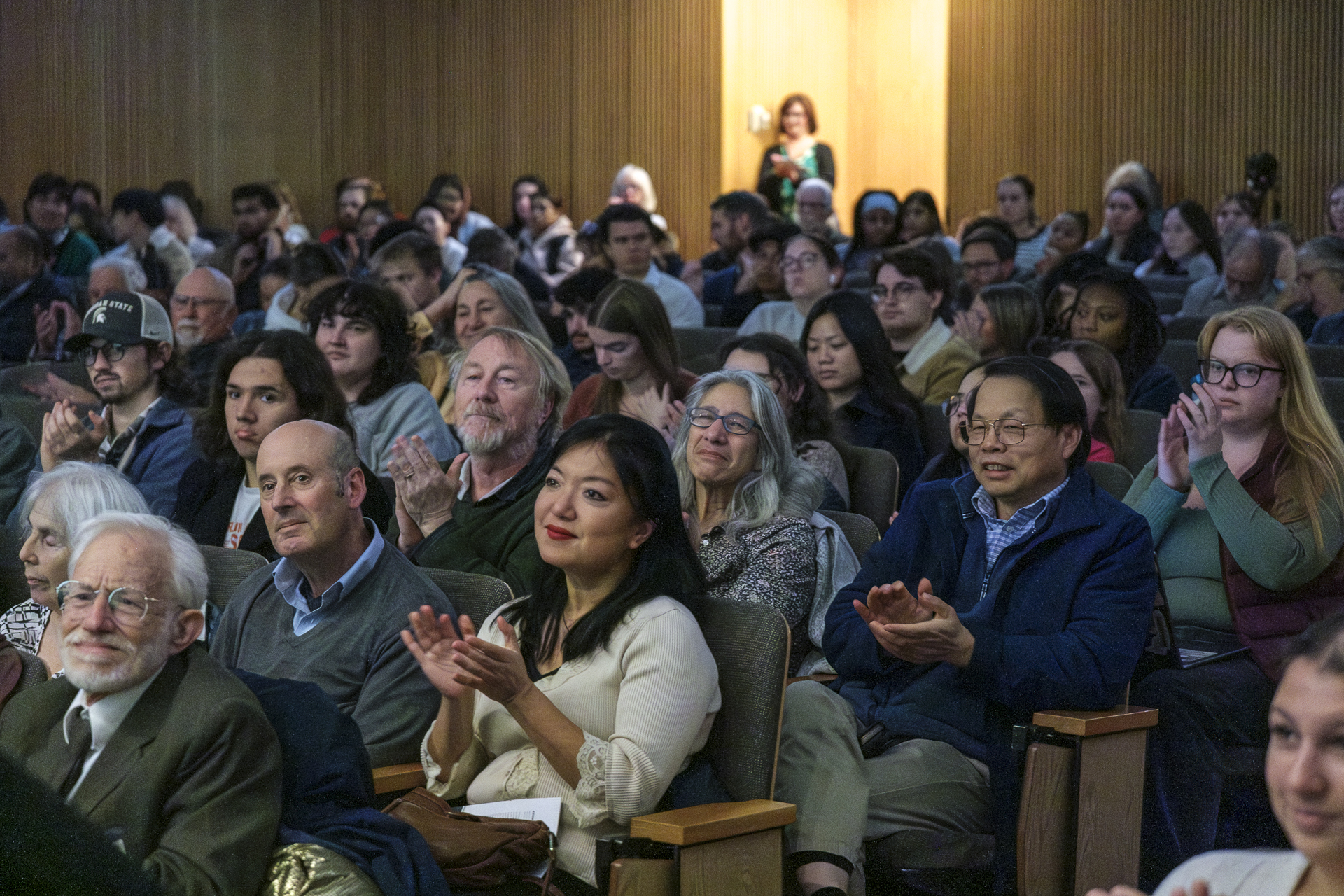 Professor Felicia Wu applaudes following Dr. Dietz's presentation